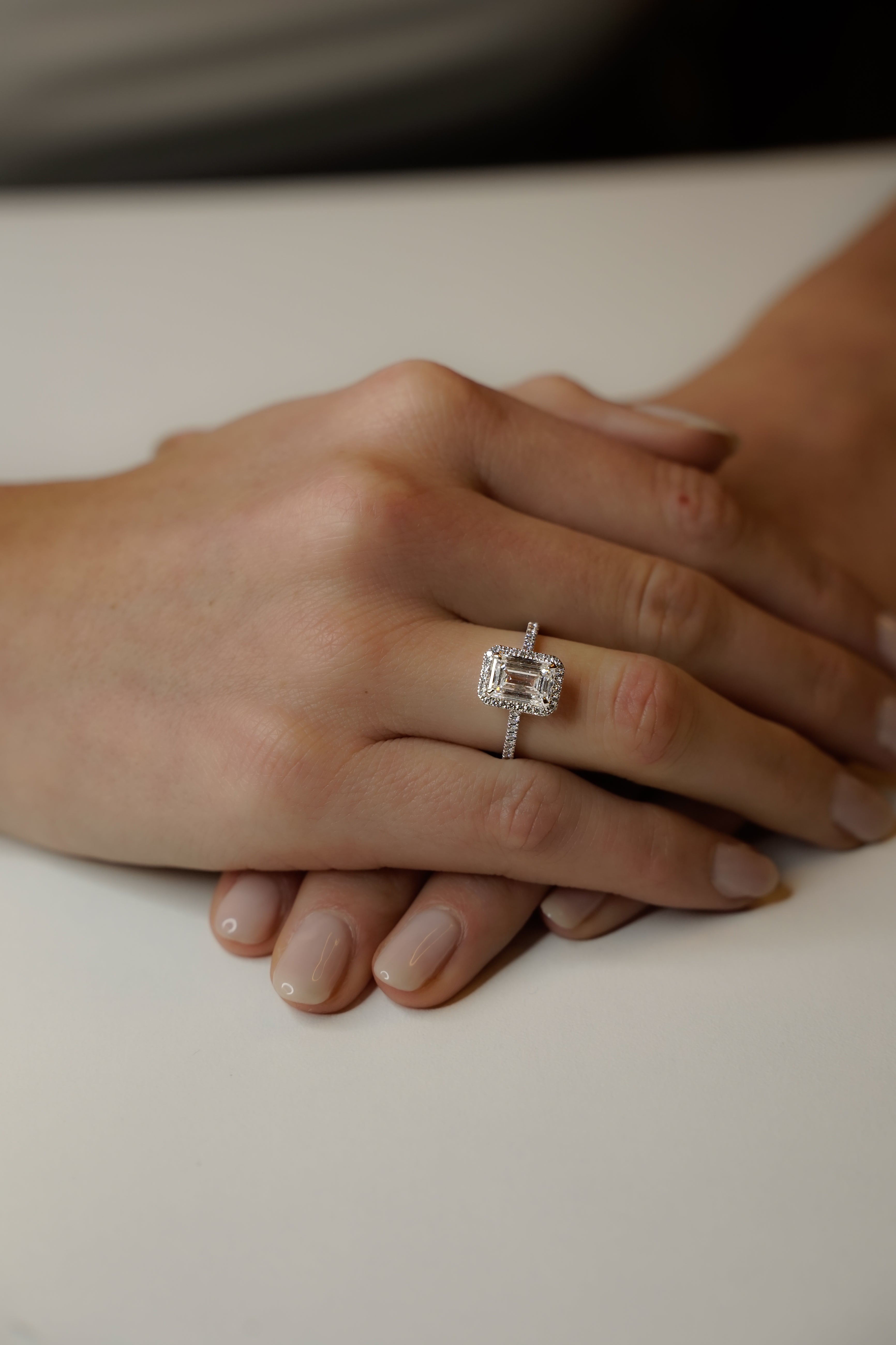 HALO EMERALD ENGAGEMENT RING