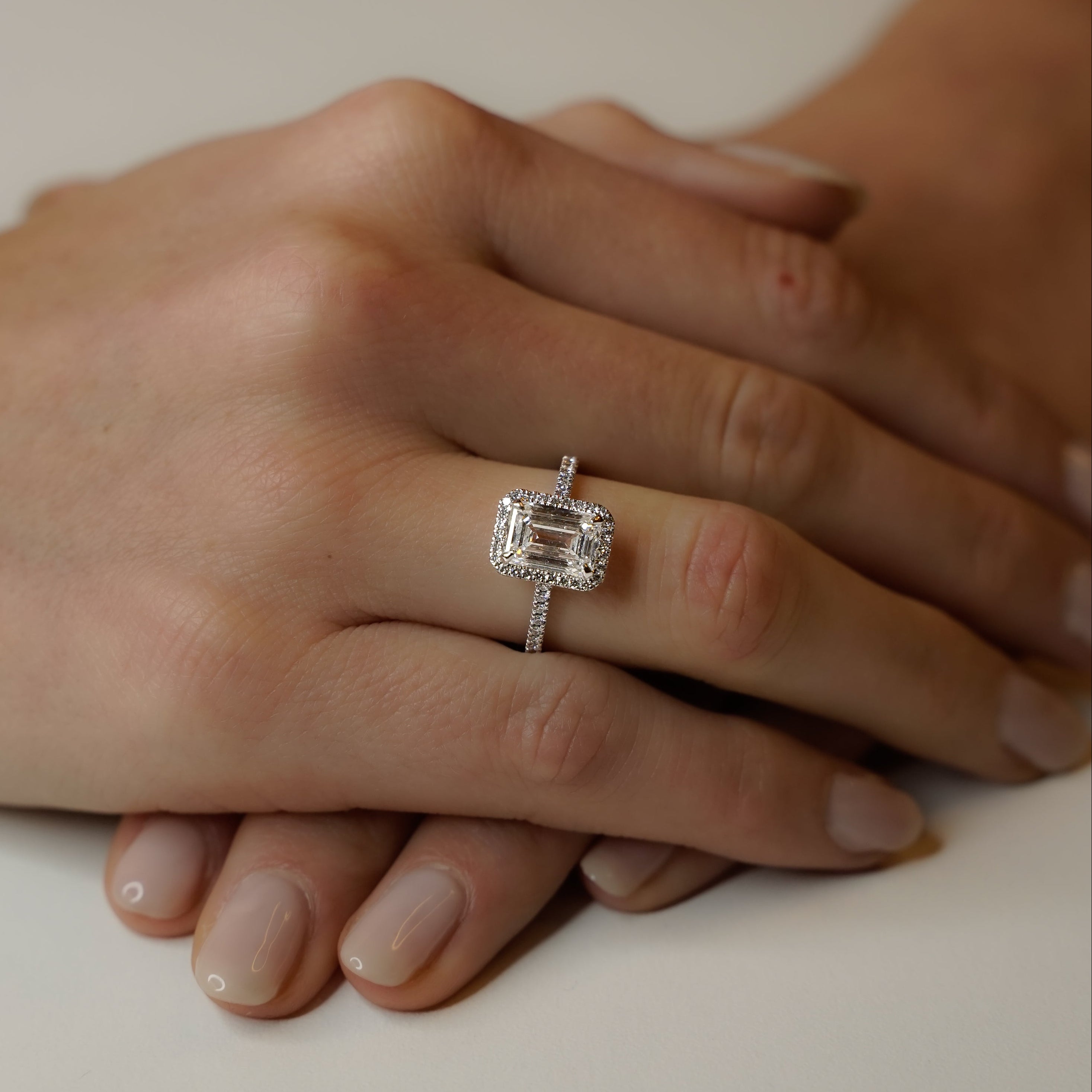 HALO EMERALD ENGAGEMENT RING