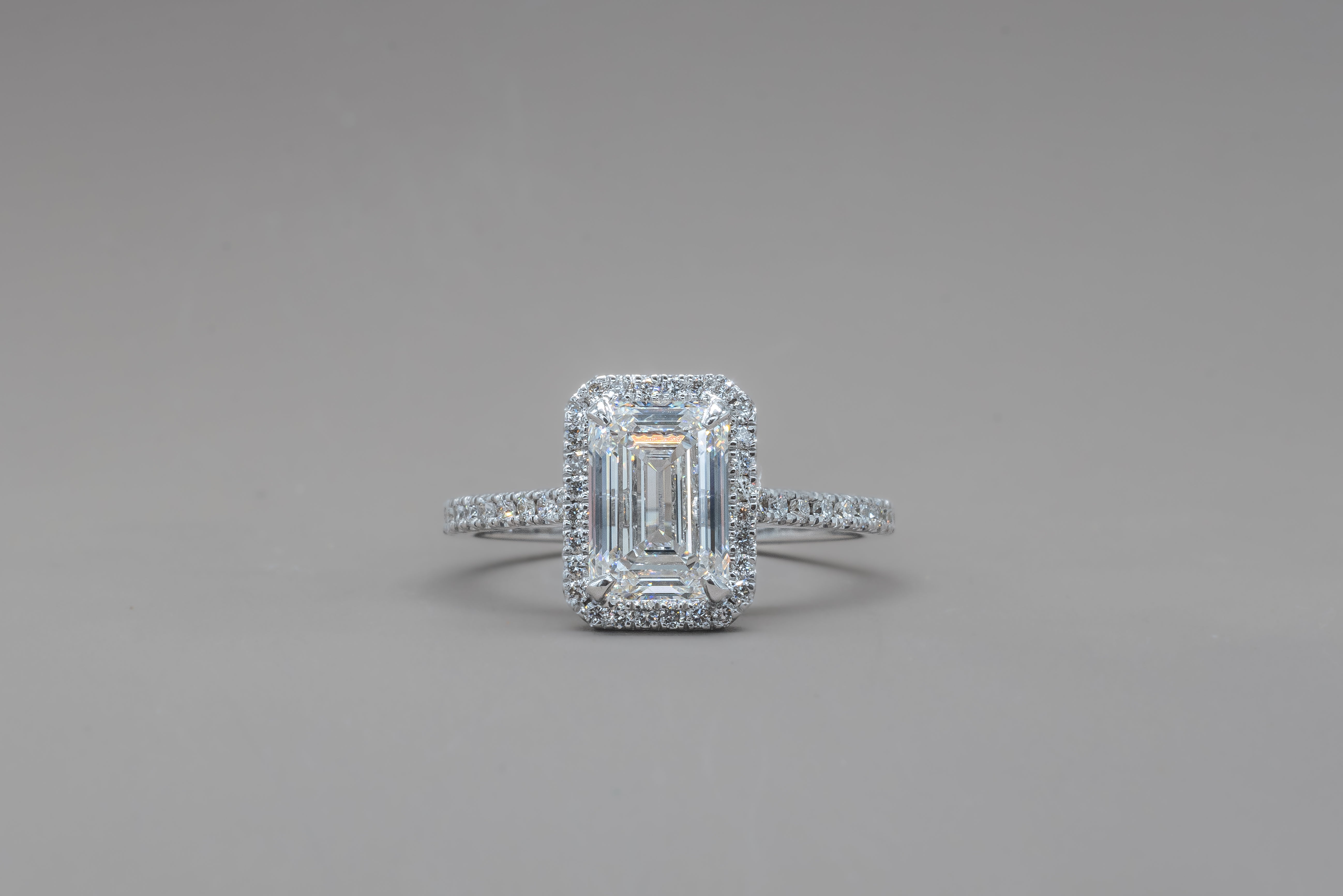 HALO EMERALD ENGAGEMENT RING