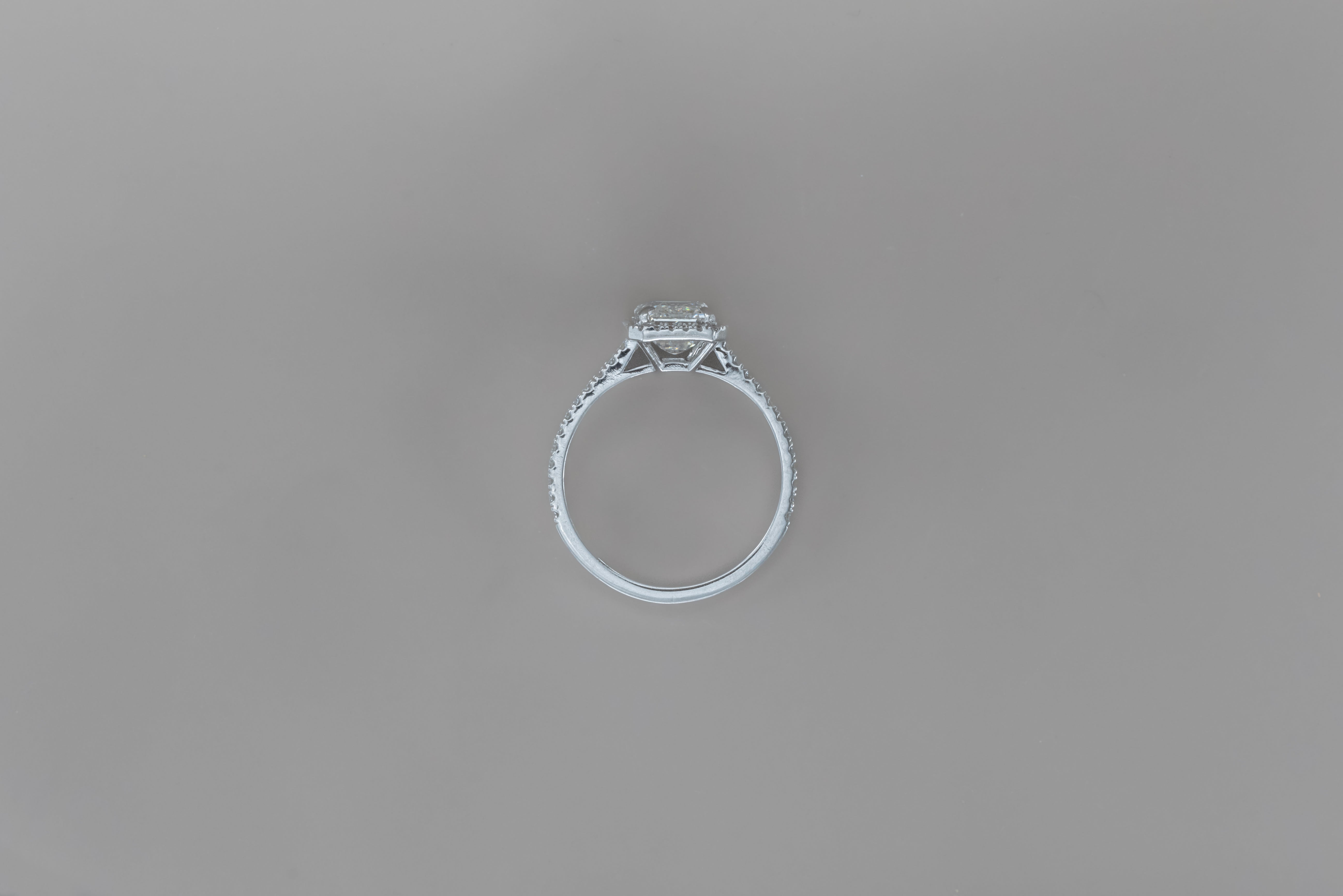 HALO EMERALD ENGAGEMENT RING